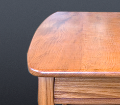 Teak coffee table designed by J.T. John for Washington based yacht; all four legs had to be different lengths to accommodate the boat's sloping floor.