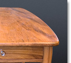 Teak coffee table designed by J.T. John for Washington based yacht; all four legs had to be different lengths to accommodate the boat's sloping floor.