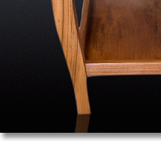 Teak coffee table designed by J.T. John for Washington based yacht; all four legs had to be different lengths to accommodate the boat's sloping floor.